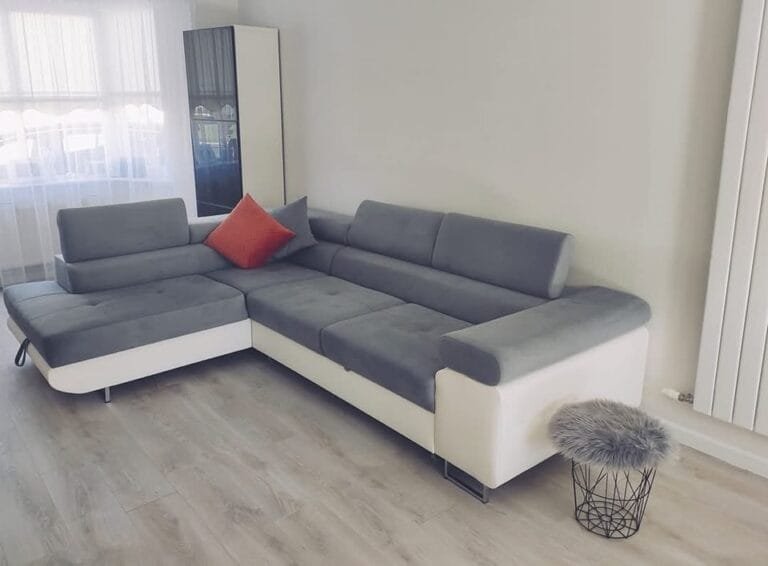 Athena Corner Sofa Bed with Storage in white and grey with red cushion from Lava Corners