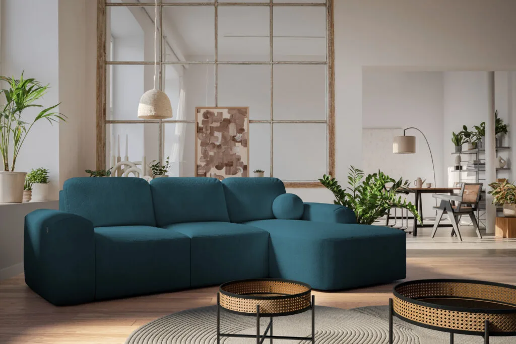Barletta corner sofa bed in teal colour, with ball cushions