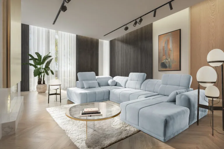 Robello VI u shape sofa bed in light blue colour with scattered cushions and adjustable headrests Lava Corners